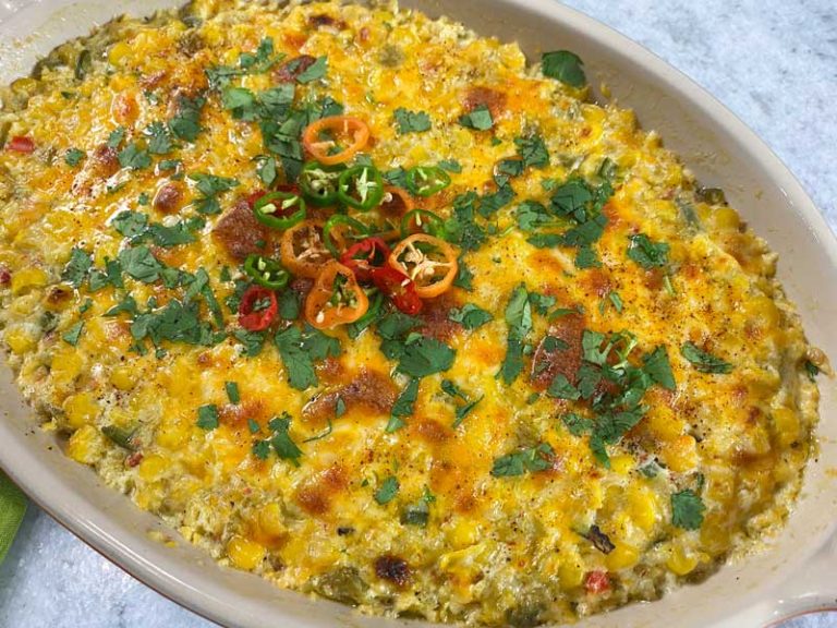 close up of corn dip in a baking dish